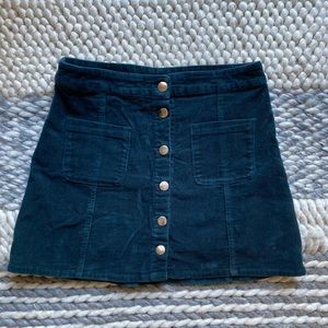 Dark green corduroy mini skirt with pockets